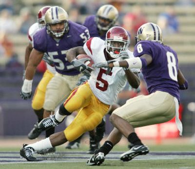 
Washington State can only hope to contain, not stop, all-purpose back Reggie Bush of Southern California, shown here against Washington. 
 (Associated Press / The Spokesman-Review)