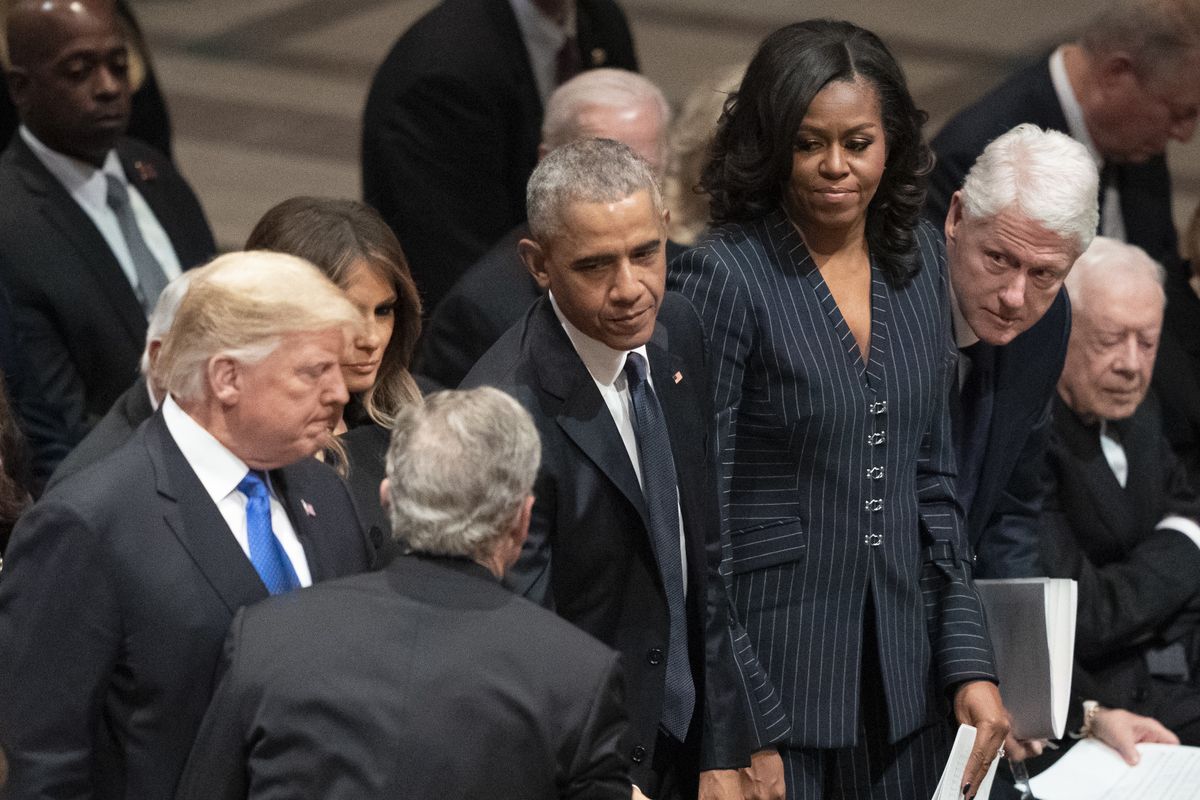 FILE - In this Dec. 5, 2018 file photo former President George W. Bush greets President Donald Trump, first lady Melania Trump, former President Barack Obama, Michelle Obama, former President Bill Clinton, former Secretary of State Hillary Clinton, and former President Jimmy Carter during a State Funeral for former President George H.W. Bush at the National Cathedral in Washington. (Carolyn Kaster)