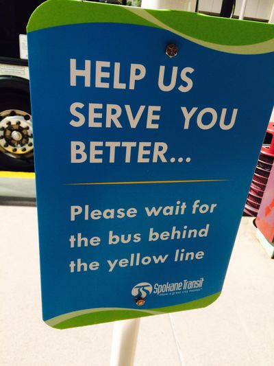 I seem to recall airport signage that attempted to keep people from crowding up against the baggage carrousels.