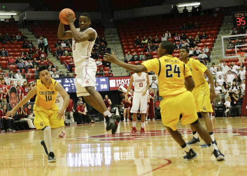 Washington State guard Ike Iroegbu grabs a rebound over California guard Brandon Chauca, left, on Thursday. (Associated Press)