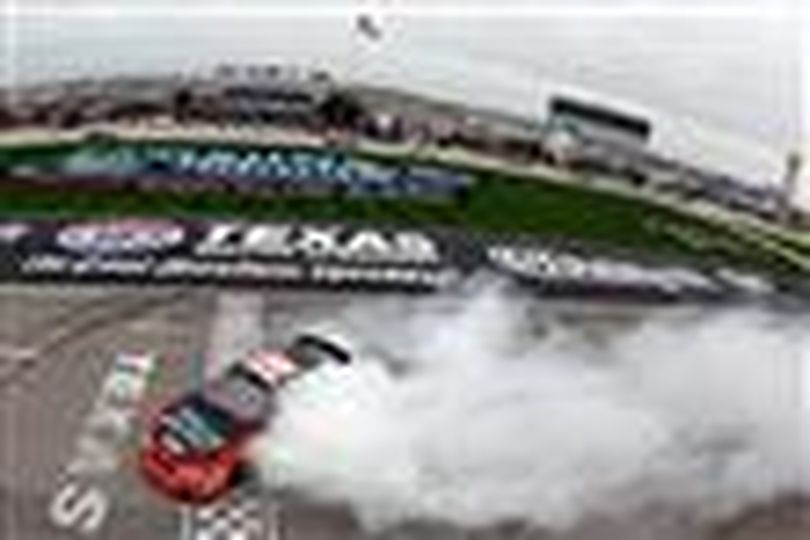 Kyle Busch performs a burnout in celebration of winning his fifth straight NASCAR Nationwide Series race at Texas Motor Speedway. This is his third victory win of the season. (Chris Graythen/Getty Images)