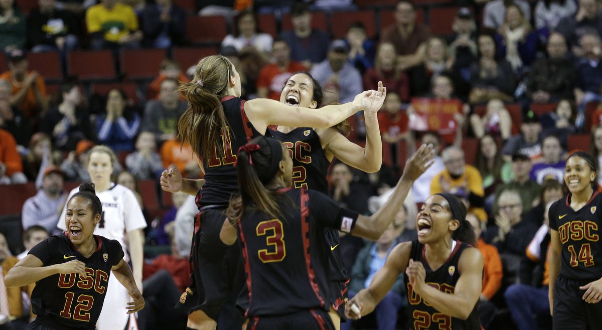 Southern California players appear ready to dance after beating Oregon State to win the Pac-12 tournament championship and the NCAA tournament berth that comes with it. (Associated Press)
