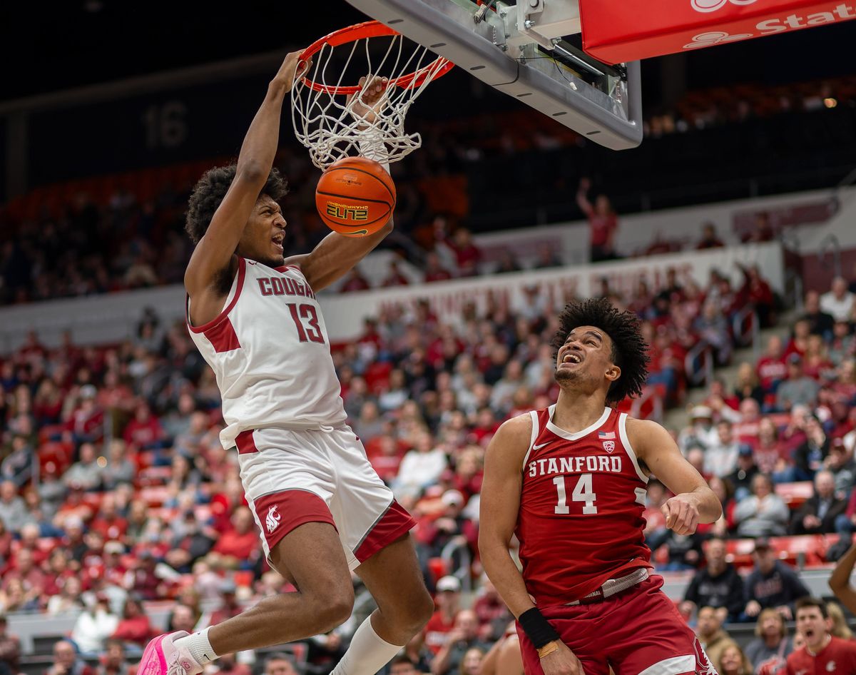 Washington State forward Isaac Jones slips past Stanford forward Spencer Jones to dunk during the second half of Saturday’s Pac-12 Conference game at Beasley Coliseum in Pullman.  (Geoff Crimmins/For The Spokesman-Review)
