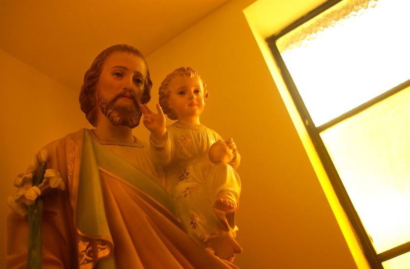 Orange afternoon light filters in on a statue of St. Joseph and the baby Jesus in St. Catherine of Siena Catholic Church in Priest River, Idaho.  The sculpture is one of the oldest in the church.  Liz Kishimoto/The Spokesman-Review
(Used in EndNotes blog April 15, 2011) (Liz Kishimoto)