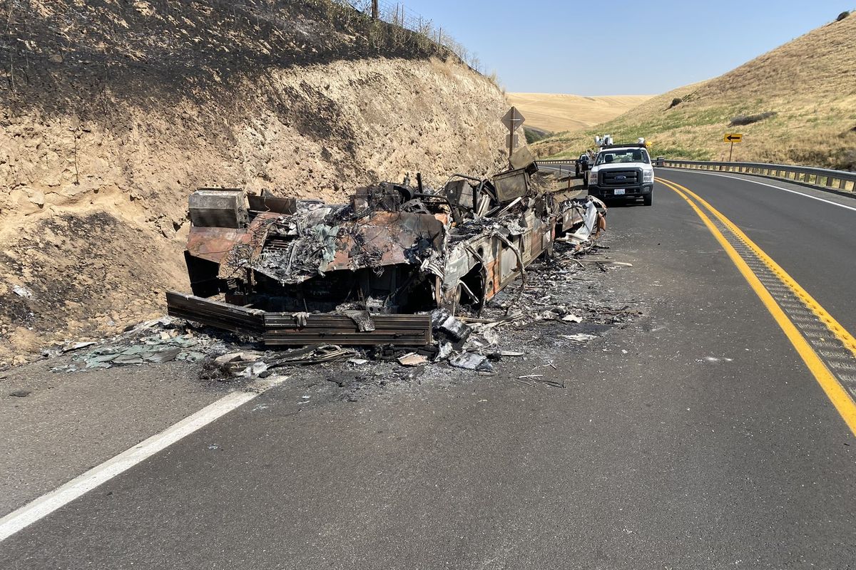 The charred remains of the motorhome that sparked the Central Ferry fire sit on the side of state Route 127.  (Washington State Department of Transportation)