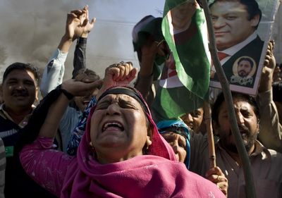 Supporters of Pakistan’s former Prime Minister Nawaz Sharif condemn a Supreme Court decision, in Rawalpindi, Pakistan, on Wednesday.  (Associated Press / The Spokesman-Review)
