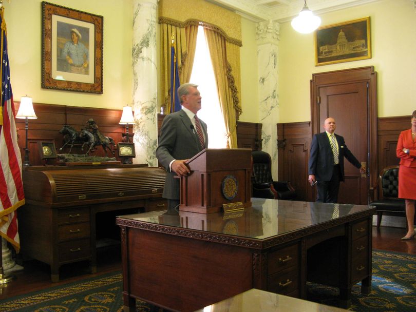 Gov. Butch Otter briefly answers questions from reporters on Monday (Betsy Russell)