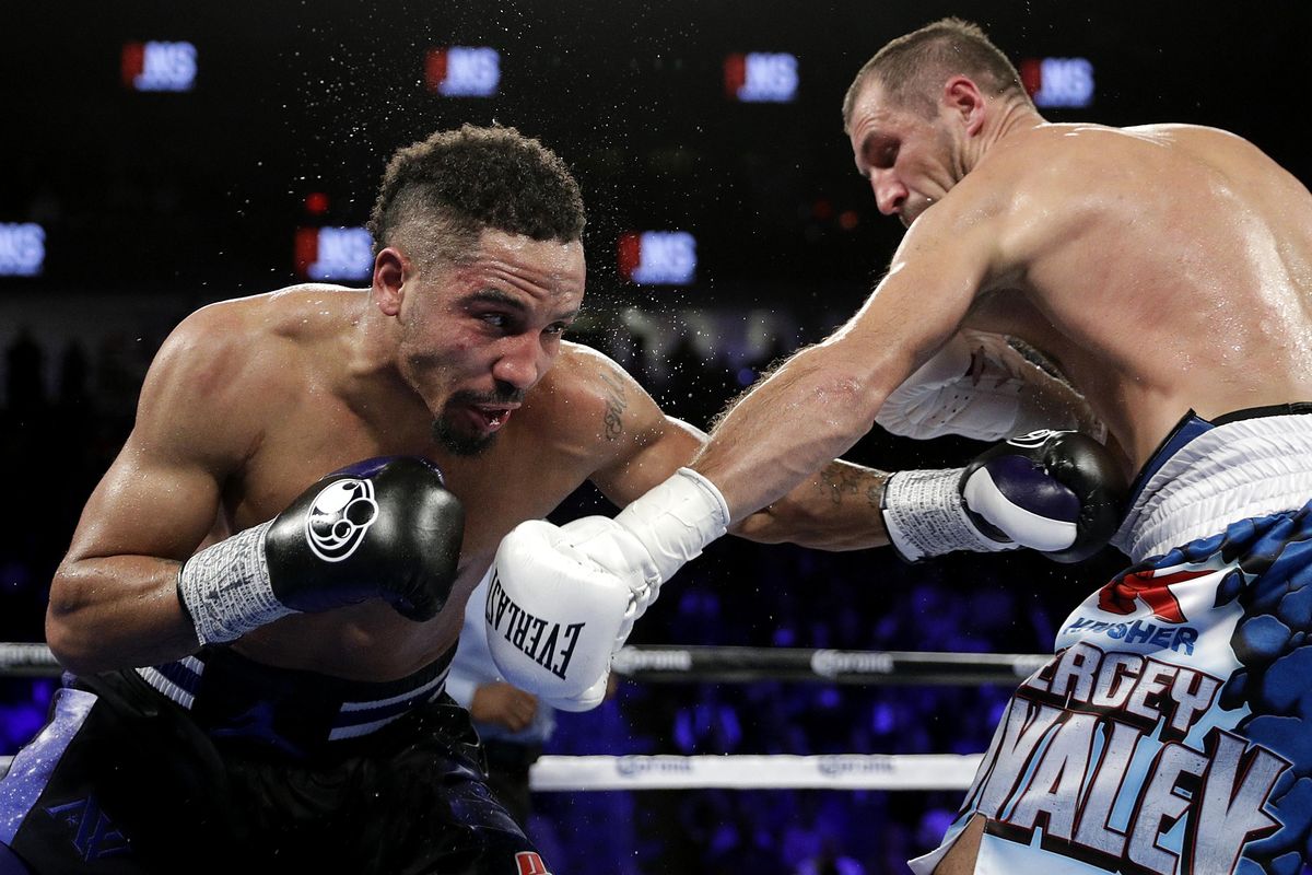 Andre Ward, left, punches Sergey Kovalev, of Russia, during their light heavyweight boxing match, Saturday, Nov. 19, 2016, in Las Vegas. (John Locher / Associated Press)