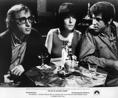 From left, Woody Allen, Diane Keaton and Tony Roberts sit side by side at a cocktail table having a drink in a scene from the film ‘Play It Again, Sam’, 1972. (Photo by Paramount/Getty Images)  (Michael Ochs Archives)