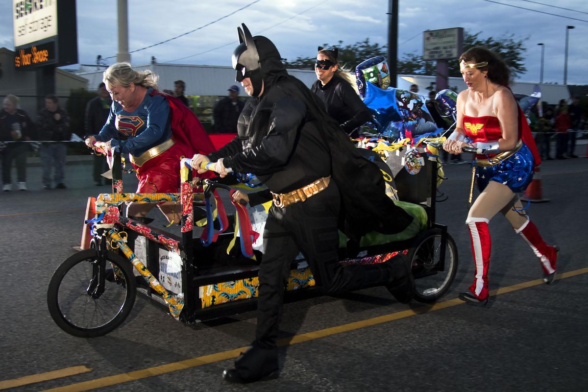 Superheroes with the Good Samaritan bed race team make their way to the finish line during the Lion Club Bed Races held on opening night of Valleyfest, Friday, Sept. 22, 2017, in the Spokane Valley. Colin Mulvany/THE SPOKESMAN-REVIEW (Colin Mulvany / The Spokesman-Review)