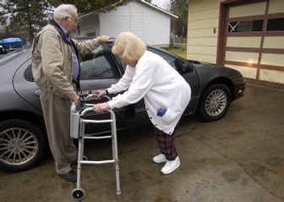 
Bob Lee helps Lily Hume into the car in front of her residence on South Glenn in the Spokane Valley. The Spokane Valley Foundation provides rides for seniors to get to appointments. 
 (Liz Kishimoto / The Spokesman-Review)