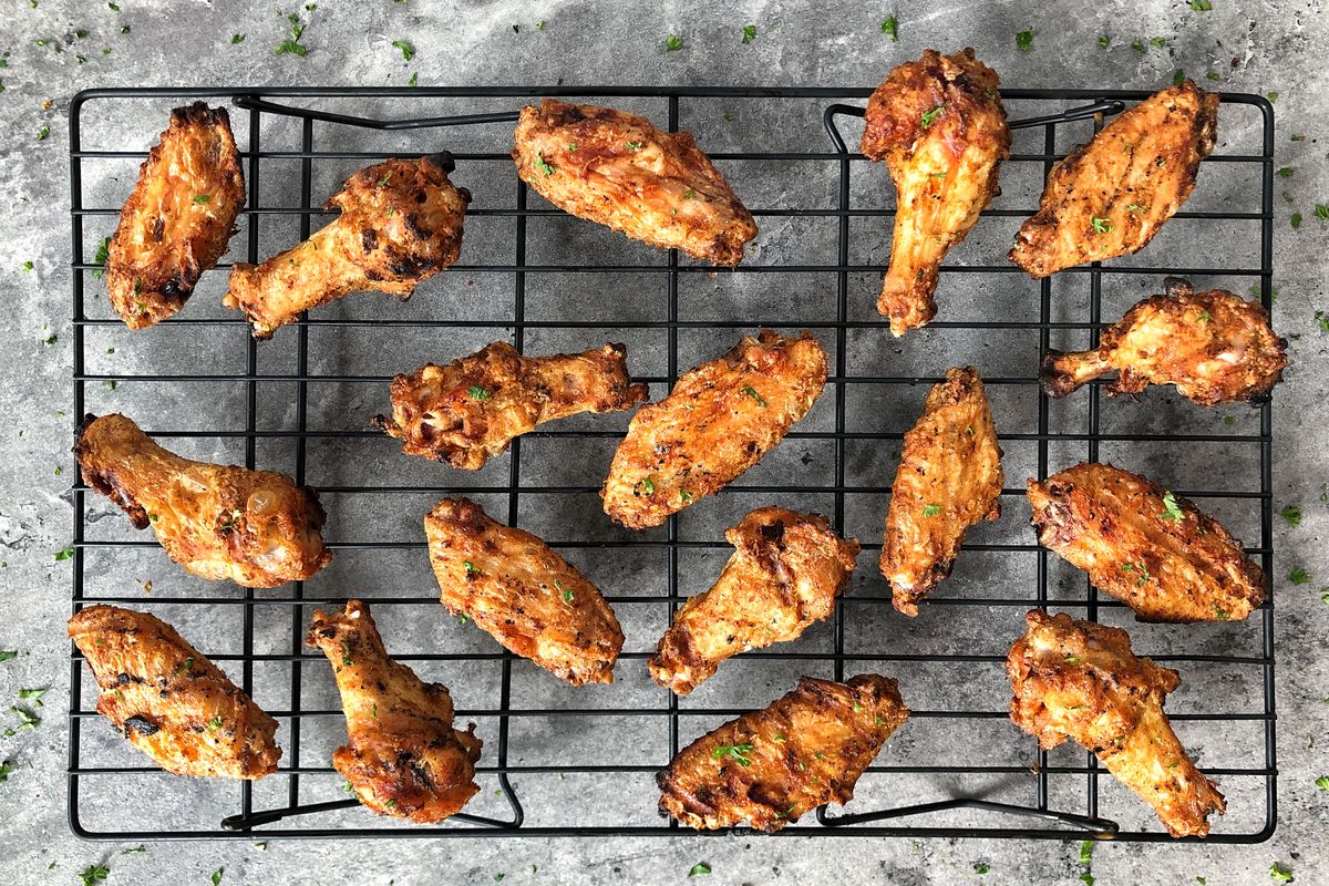 Corn starch in this chicken wing recipe absorbs excess moisture while locking in flavor.  (Audrey Alfaro/For The Spokesman-Review)
