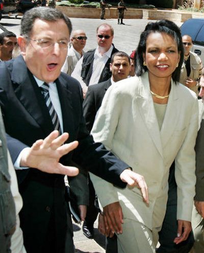 
Lebanon's Prime Minister Fuad Saniora helps  clear the way in Beirut for U.S. Secretary of State Condoleezza Rice. 
 (Associated Press / The Spokesman-Review)