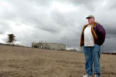 
Roger Saterfiel, director of Kootenai County Solid Waste Department, stands at Pleasant View Road and Prairie Avenue near Hauser on Friday where a proposed zone change would allow a garbage transfer station to be built. It would take the pressure off the Ramsey transfer station in Coeur d''Alene. 
 (Jesse Tinsley / The Spokesman-Review)