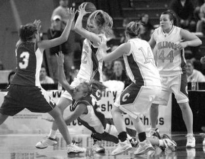 Colfax's Elise Markley grabs a loose ball from Kelli Cutright of King's as teammates Jordan Harazin (14) and Kylie Shaw (44) watch. 
 (Associated Press / The Spokesman-Review)