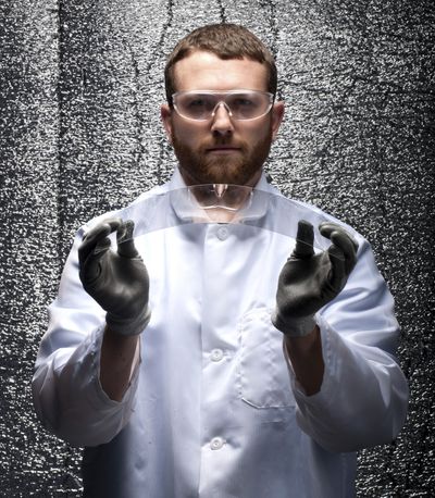 A model flexes a piece of Gorilla glass manufactured by Corning. The ultra-strong glass has been looking for a purpose since its invention in 1962. Corning is hoping it becomes a multibillion-dollar bonanza.  (Associated Press)