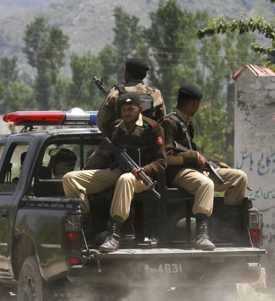 Pakistani soldiers patrol in the vicinity of a compound where it is believed al-Qaida leader Osama bin Laden lived in Abbottabad, Pakistan, on Monday. (Associated Press)