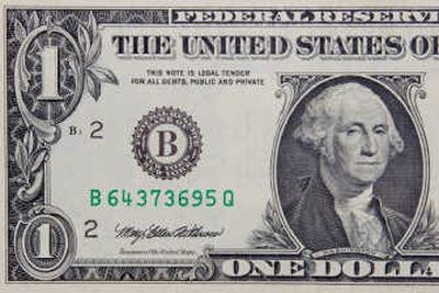 
Falling dollar cuts consumers' purchasing power.
 (The Spokesman-Review)