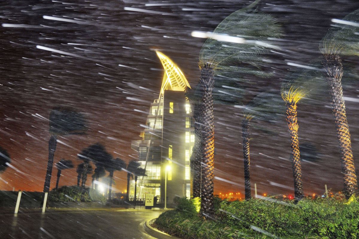 Trees sway from heavy rain and wind from Hurricane Matthew  in front of Exploration Tower early Friday, Oct. 7, 2016 in Cape Canaveral, Fla.   Matthew weakened slightly to a Category 3 storm with maximum sustained winds near 120 mph, but the U.S. National Hurricane Center says it