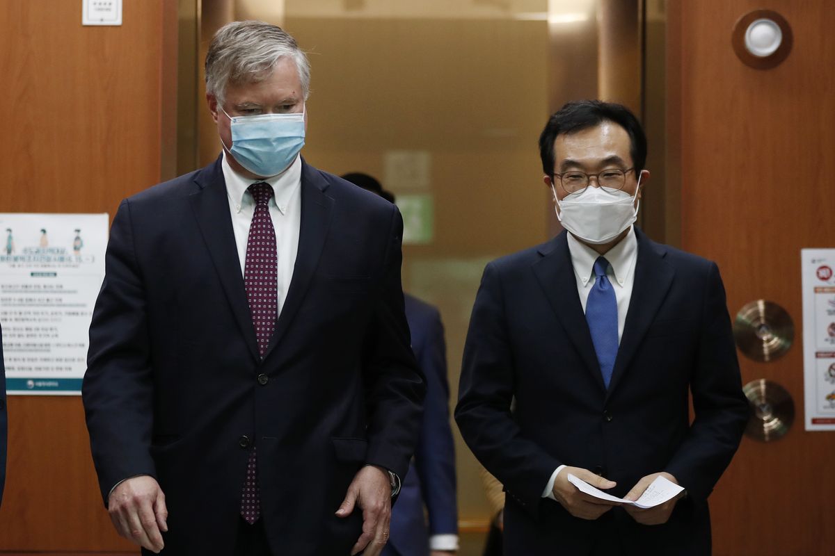 U.S. Deputy Secretary of State Stephen Biegun, left, walks with his South Korean counterpart Lee Do-hoon after their meeting at the Foreign Ministry in Seoul Wednesday, July 8, 2020. Biegun is in Seoul to hold talks with South Korean officials about allied cooperation on issues including North Korea. (Kim Hong-ji)