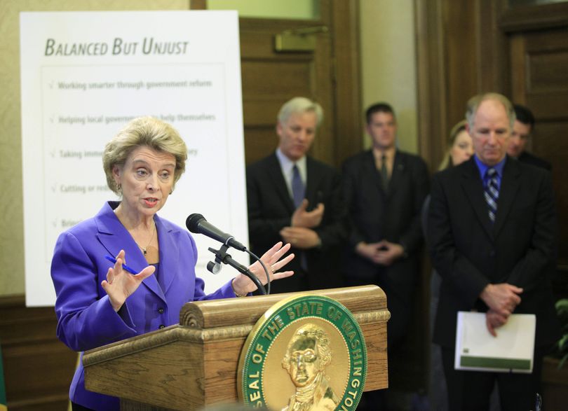 Gov. Chris Gregoire talks to reporters in Olympia, Wash., Wednesday, Dec. 9, 2009, about her plan for balancing the state's $2.6 billion budget deficit using only the state's existing tax streams. The budget included proposed cuts in spending for health care, welfare, and education programs across the state of Washington. (Ted Warren / Associated Press)
