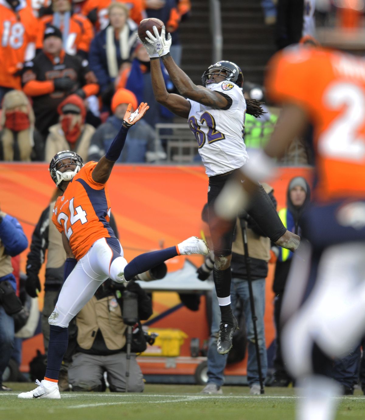 Torrey Smith makes one of his two TD catches against Champ Bailey in a playoff win over the Broncos. (Associated Press)