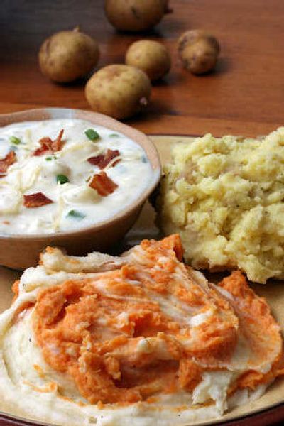 
Clockwise from foreground, Two Potato Mash, Baked Potato Soup, and Manchego Smashed Potatos are three great ways to liven up the Thanksgiving staple.
 (Associated Press / The Spokesman-Review)