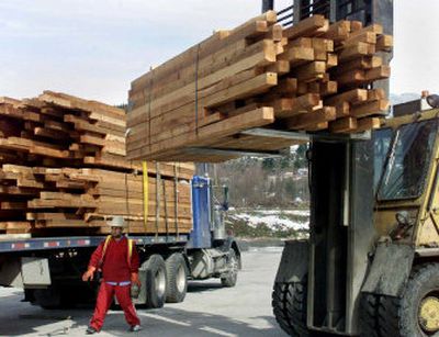 
Cedar is loaded for export to the United States at Interfor's mill in Squamish, B.C. Canada has suspended softwood lumber talks with the United States. 
 (File/Associated Press / The Spokesman-Review)