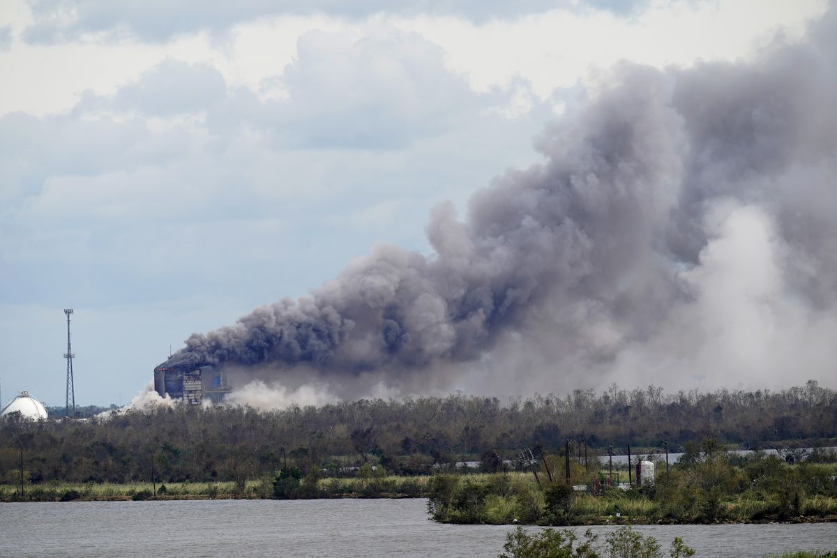A fire at BioLab Inc., a chemical plant that handles chlorine for swimming pools, burns on Thursday in Westlake, La., in the aftermath of Hurricane Laura.  (Gerald Herbert/Associated Press)