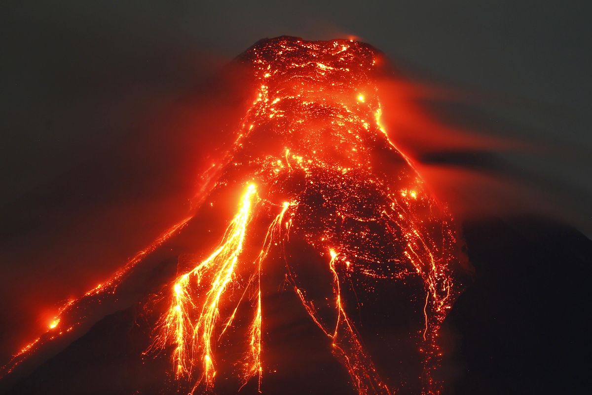 Mayon volcano spews molten lava during its sporadic eruption early Thursday, Jan. 25, 2018 as seen from a village in Legazpi city, Albay province, around 340 kilometers (200 miles) southeast of Manila, Philippines. The Philippine Institute of Volcanology and Seismology said the volcano that