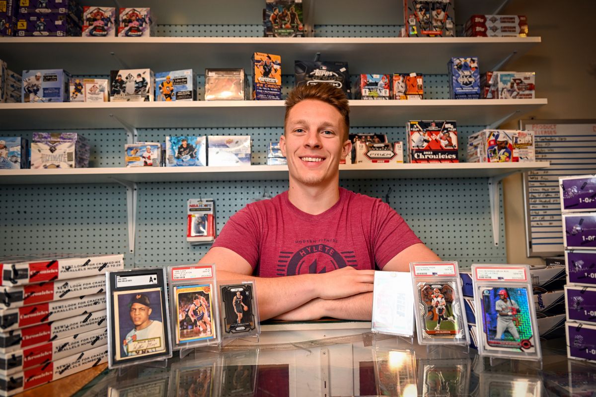 Jordan Athos, who owns and operates Spokane Valley Sportscards at 9404 East Sprague, is shown Tuesday inside his small shop where he sells traditional sports cards and a variety of card-based games.  (Jesse Tinsley/THE SPOKESMAN-REVIEW)