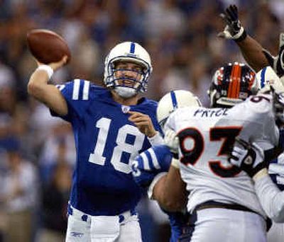 
Indianapolis Colts quarterback Peyton Manning has thrown 41 touchdown passes and is closing in on Dan Marino's record of 48. 
 (Associated Press / The Spokesman-Review)