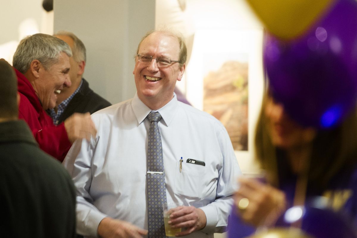 Mark Rypien, left, a former Cougar quarterback and Super Bowl MVP with the Washington Redskins, jokes with former offensive tackle and Spokane local Rob Kuharski right, during a mix-and-mingle Apple Cup event on Tuesday, Nov. 22, 2016, in River Park Square’s Kress Gallery in Spokane, Wash. TYLER TJOMSLAND tylert@spokesman.com (Tyler Tjomsland / The Spokesman-Review)