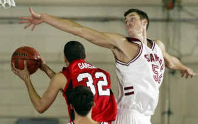 
Louisville's Francisco Garcia gets a shot under the defense of Stanford's Matt Haryasz in the first half of the in fifth-place Wednesday.
 (Associated Press / The Spokesman-Review)