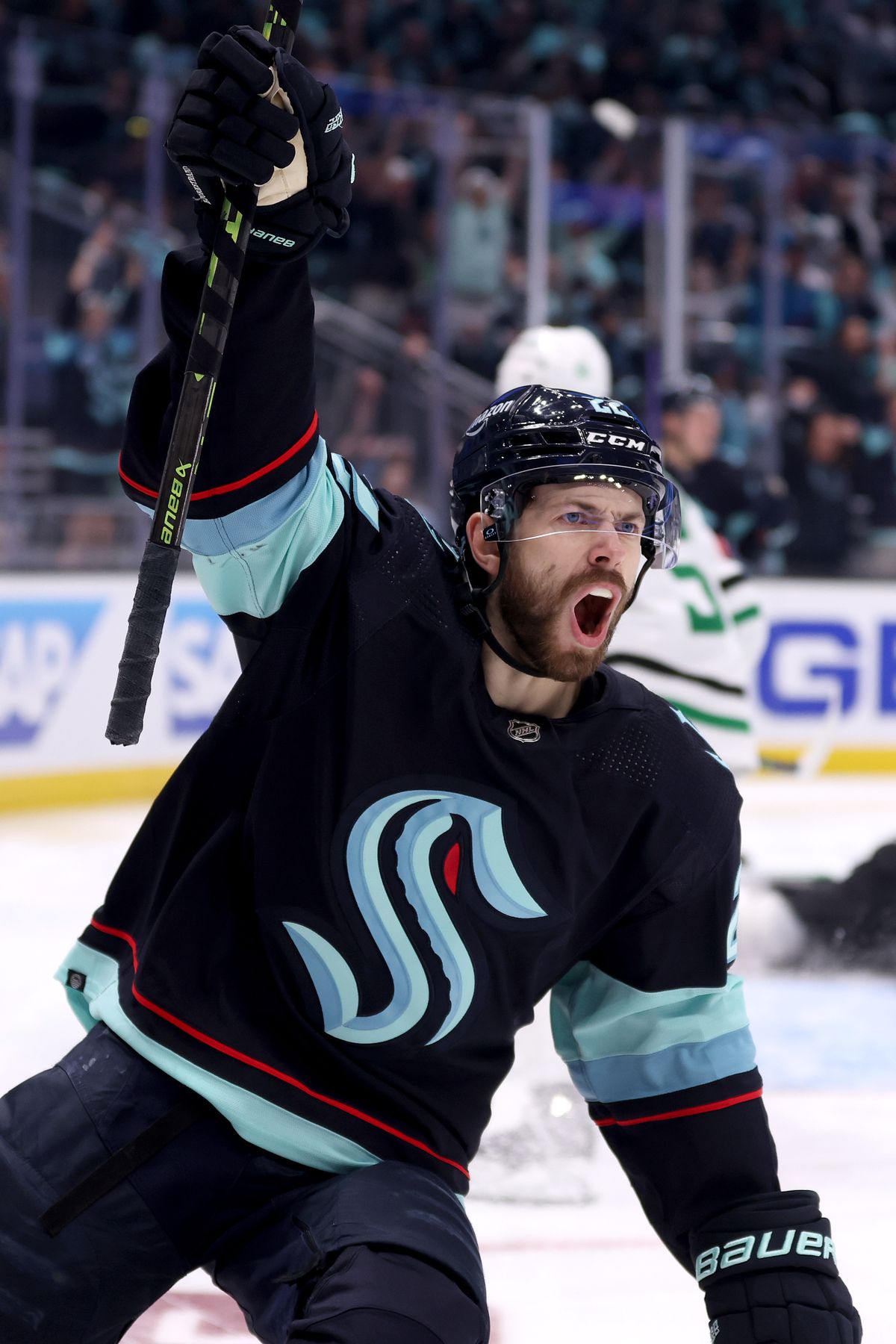 Oliver Bjorkstrand celebrates his assist to Eeli Tolvanen during the second period against Dallas on Saturday in Seattle.  (Getty Images)