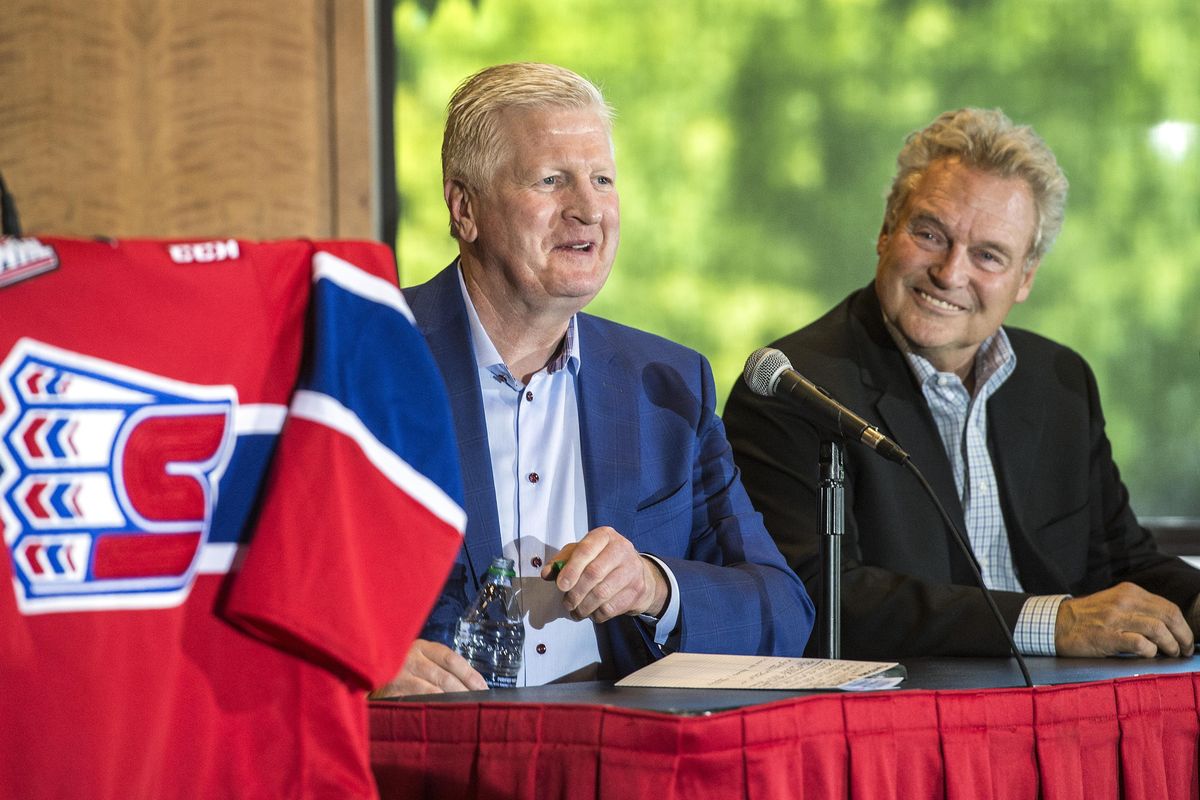 Spokane Chiefs General Manager Tim Speltz, left, and team owner Bobby Brett gather Tuesday afternoon, Aug. 16, 2016, to announce the departure of Speltz to the Toronto Maple Leafs. The Chiefs have hired Scott Carter to replace Speltz. (Dan Pelle / The Spokesman-Review)