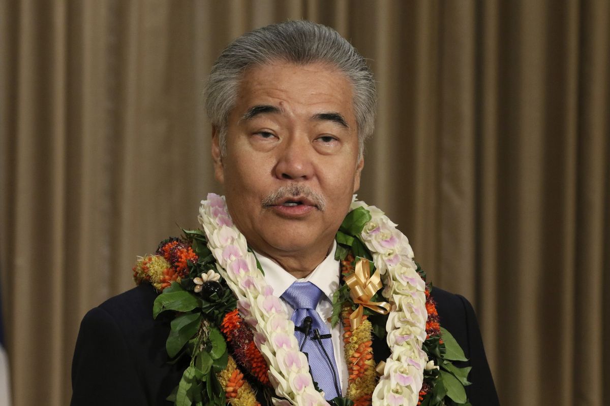 In this Jan. 21, 2020 photo, Gov. David Ige speaks to reporters in Honolulu after delivering his state of the state address at the Hawaii State Capitol. While governors across the country are ending all or most of their coronavirus restrictions, many of them are keeping their pandemic emergency orders in place. Those orders allow them to restrict public gatherings and businesses, mandate masks, sidestep normal purchasing rules, tap into federal money and deploy National Guard troops to administer vaccines.  (Audrey McAvoy)