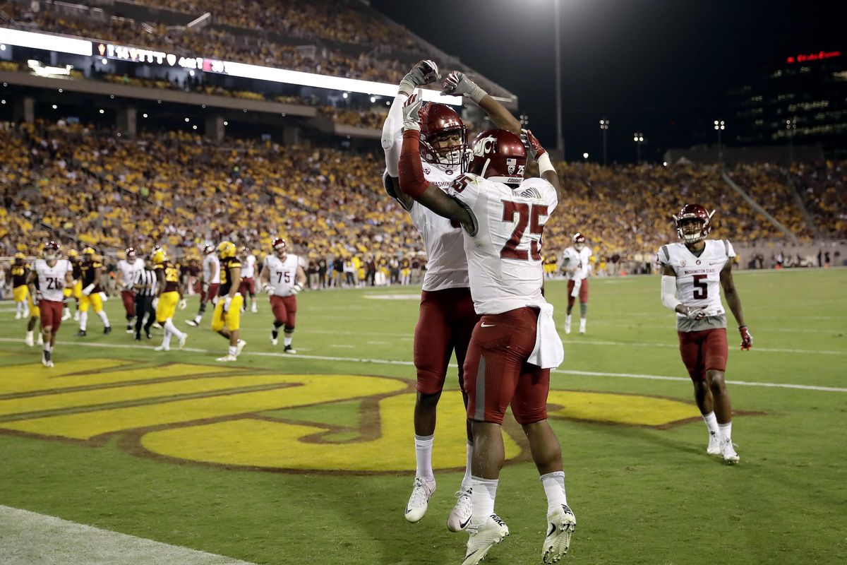 Washington State running back Jamal Morrow (25) celebrates his touchdown catch with teammate Isaiah Johnson-Mack during the second half of an NCAA college football game against Arizona State, Saturday, Oct. 22, 2016, in Tempe, Ariz. (Matt York / Associated Press)