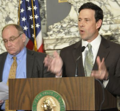 OLYMPIA -- Senate Ways and Means Committee Chairman Andy Hill, R-Redmond, describes the budget proposal as the committee's ranking Democrat, Sen. Jim Hargrove of Hoquiam waits to discuss it. (Jim Camden)