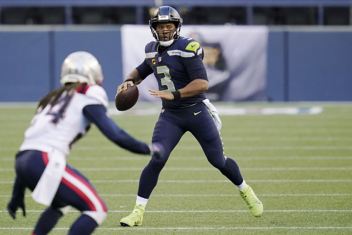 Seattle quarterback Russell Wilson has completed 52 of 63 passes this season for nine touchdowns.  (Elaine Thompson)