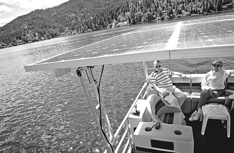  Richard Trudell cruises Tuesday on Hayden Lake on the solar-powered pontoon boat he designed and built so he could enjoy quiet outings on the lake with his wife, Nancy Morrison, and friends.  (Jerome A. Pollos)