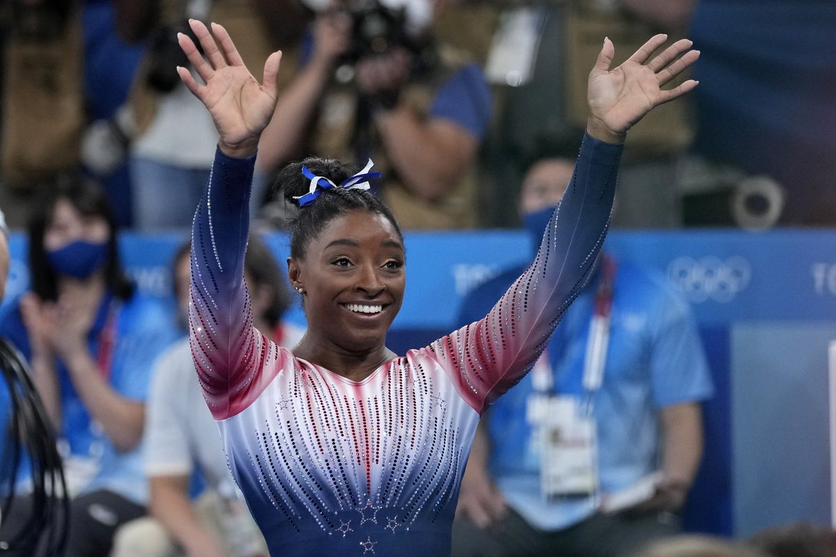 Simone Biles, of the United States, waves to supporters after performing on the balance beam during the artistic gymnastics women’s apparatus final at the 2020 Summer Olympics on Tuesday in Tokyo, Japan.  (Ashley Landis)