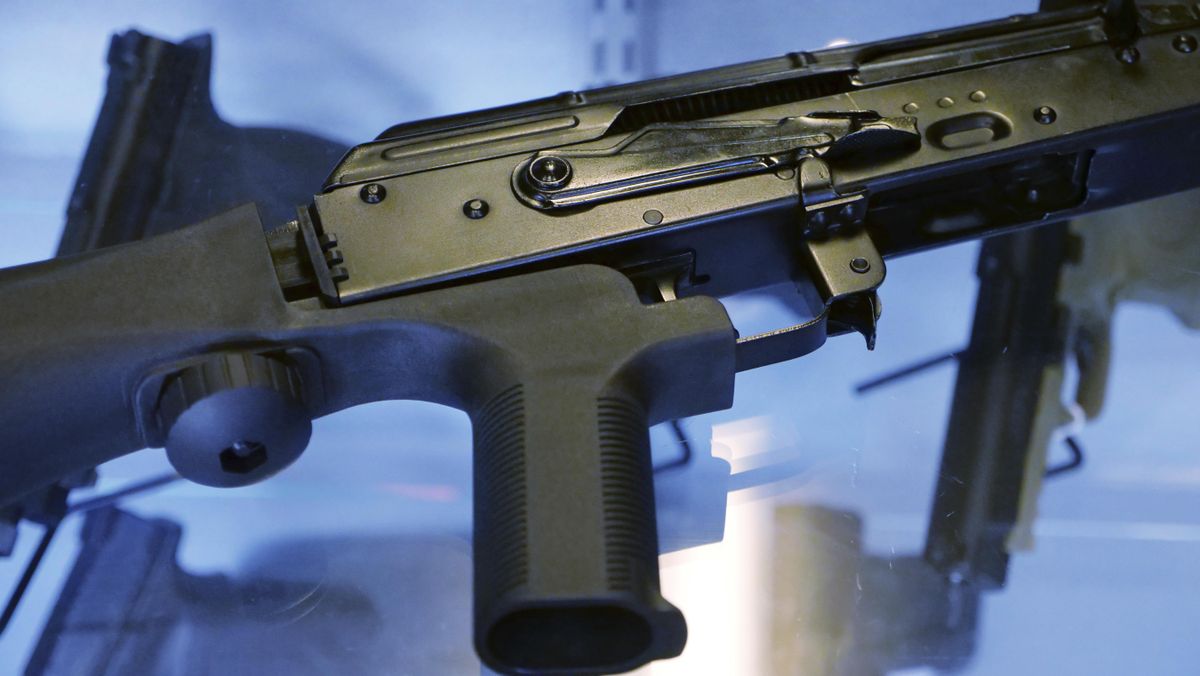A little-known device called a “bump stock” is attached to a semi-automatic rifle at the Gun Vault store and shooting range Wednesday, Oct. 4, 2017, in South Jordan, Utah. Las Vegas shooter Stephen Paddock bought 33 guns within the last year, but that didn’t raise any red flags. Neither did the mountains of ammunition he was stockpiling, or the bump stocks found in his hotel room that allow semi-automatic rifles to mimic fully automatic weapons. (Rick Bowmer / Associated Press)