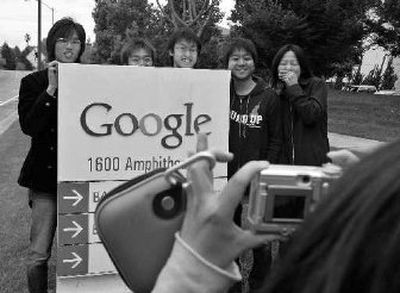 University computer students from Tokyo pose for pictures as they tour Google headquarters in Mountain View, Calif., on Thursday.
(Associated Press / The Spokesman-Review)