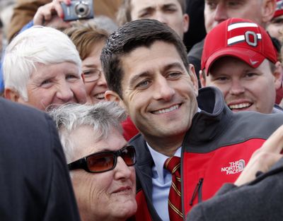 Republican vice presidential candidate, Rep. Paul Ryan, R-Wis. poses with supporters after speaking at a campaign rally at the Valley View Campgrounds in Belmont, Ohio, Saturday, Oct. 20, 2012, where he talked about economic conditions and the coal industry. (Keith Srakocic / Associated Press)