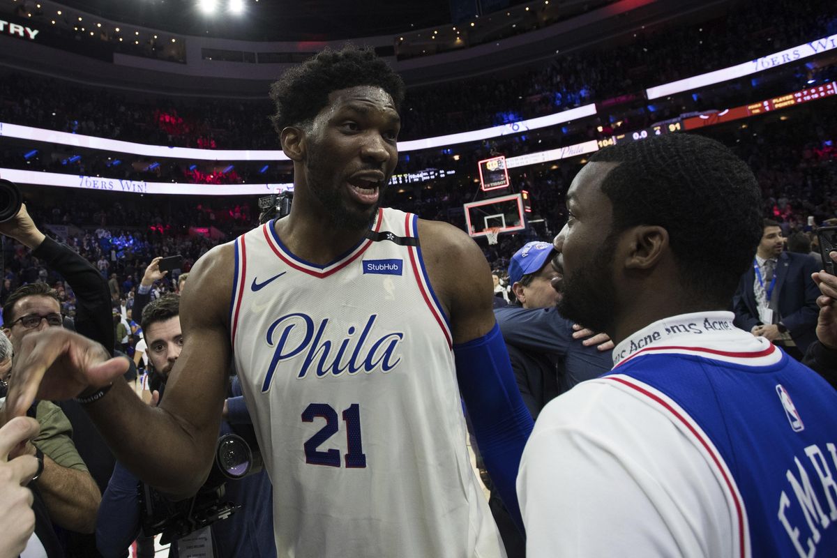 Philadelphia 76ers’ Joel Embiid, left, of Cameroon, talks with Rapper Meek Mill, right, during the second half in Game 5 of a first-round NBA basketball playoff series against the Miami Heat, Tuesday, April 24, 2018, in Philadelphia. The 76ers won 104-91. (Chris Szagola / Associated Press)