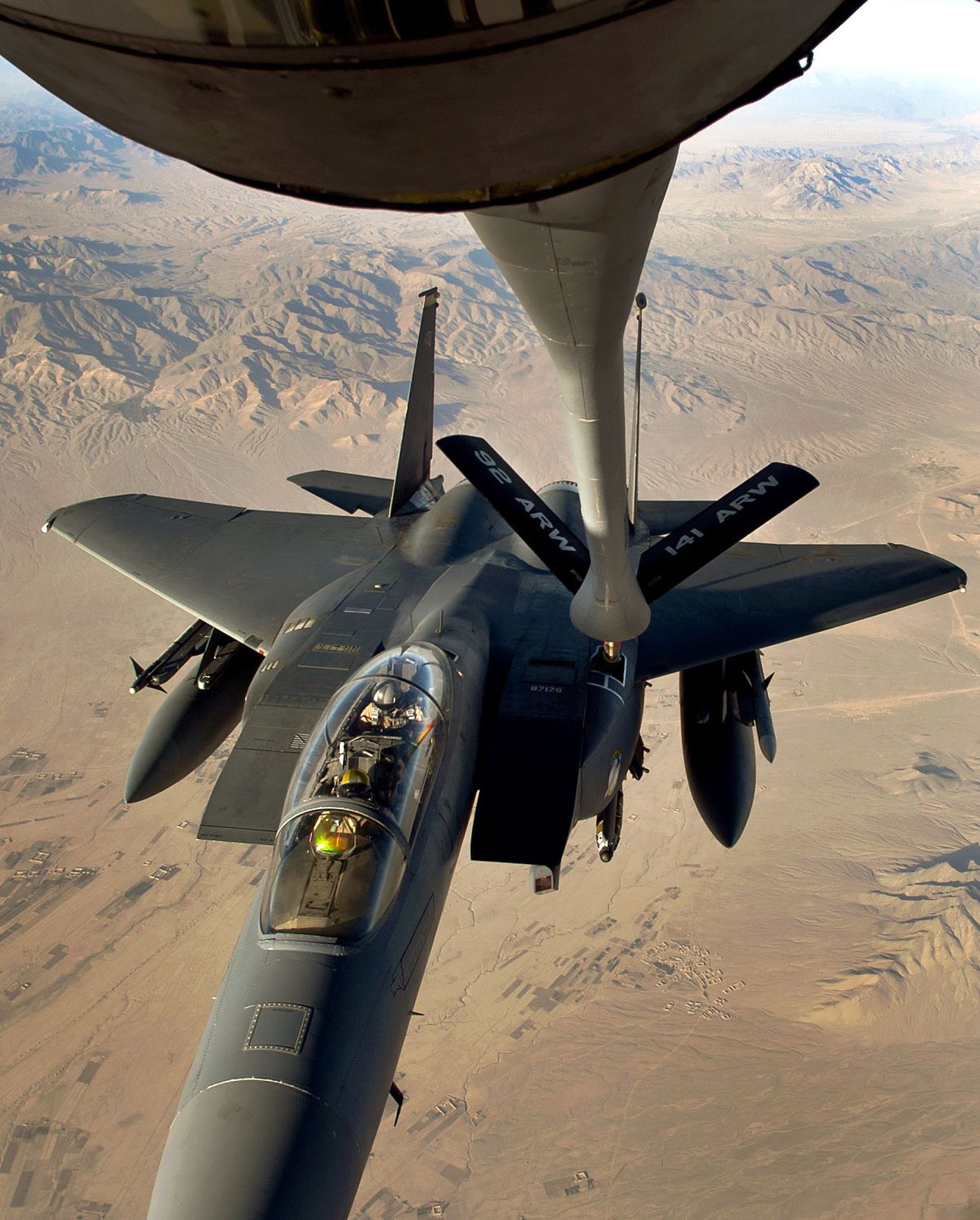 In a delicate dance between man and machine high above Afghanistan, an F-15E Strike Eagle tops off its tanks with jet fuel provided by a  92nd Air Refueling Wing KC-135R Stratotanker.  (Colin Mulvany)