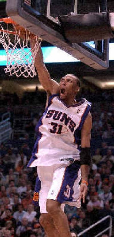 
Phoenix Suns forward Shawn Marion  dunks during the third quarter against the Portland Trail Blazers Saturday.
 (Associated Press / The Spokesman-Review)