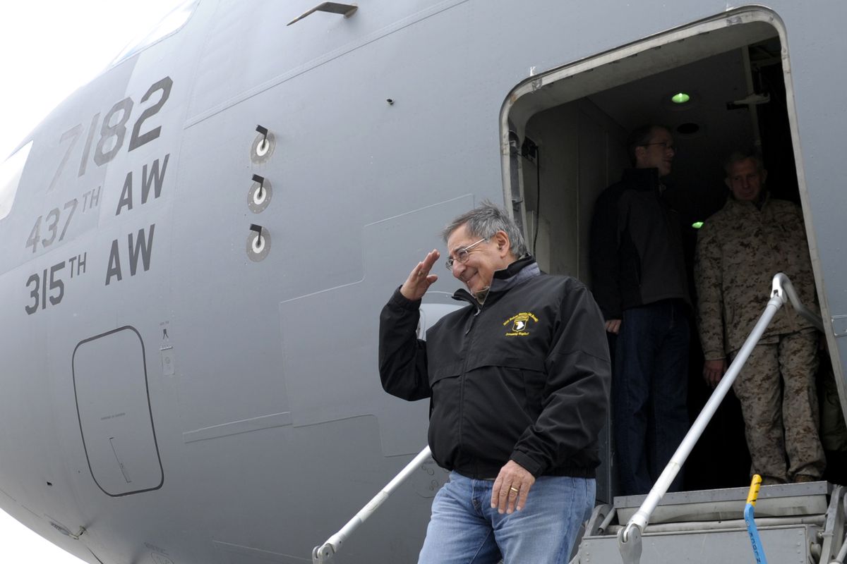 U.S. Defense Secretary Leon Panetta salutes as he walks off of his plane after arriving at Kandahar Airfield in Kandahar, Afghanistan, Thursday, Dec. 13, 2012. (Susan Walsh / Ap Pool)