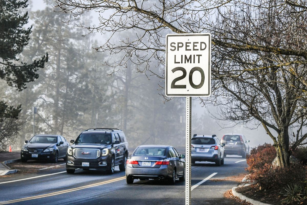 Vehicles travel along High Drive at Manito Boulevard, under a 20 mph speed limit in November, 2021, in Spokane. The Spokane City Council voted on Monday to reset the speed limit on High Drive at 30 mph.  (DAN PELLE/THE SPOKESMAN-REVIEW)